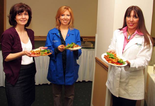 No complaints about this hospital food Serving a ìGet Your Plate in Shapeî special are, from left, Gigi Fried, registered dietitian at St. Anthony Community Hospital; volunteer student dietitian Stacie Lynch; and Janine Killeen, the hospitalís lead dietitian.