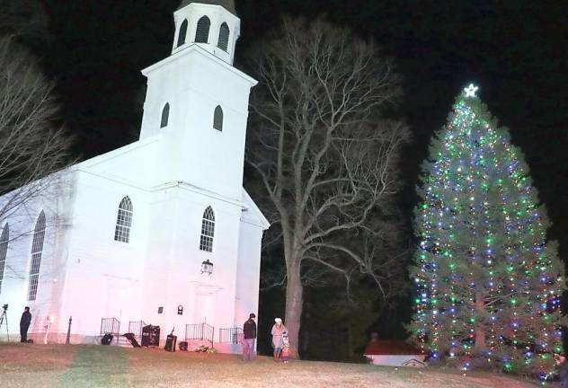 The Historical Society of the Town of Warwick has helped the Warwick Fire Department continue its long tradition by graciously providing the magnificent evergreen, just outside its Old School Baptist MeetingHouse.