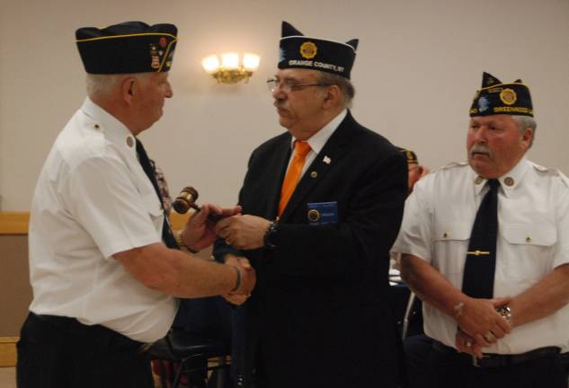Greenwood Lake Tom Mulcahy sworn in as commander of Arthur Finnegan American Legion Post 1443 Photo by Ed Bailey Tom Mulcahy, left, accepts the gavel from Orange County Legion Commander Vincent F. Gallipoli, center, during his installation Saturday, June 1, as the new commander of the Greenwood Lake Arthur Finnegan American Legion Post 1443. Outgoing Post Commander Gerry Brewer is at the right.