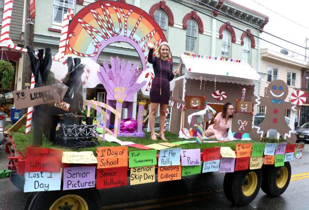 Crowds enjoy another Homecoming Day Parade on Main Street Local and school officials served as judges and voted first place to the seniors for their “Candyland” float.