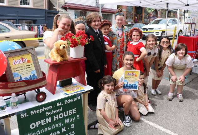 Warwick Community Showcase enjoys near-perfect weather and huge turnout There was also a special treat for anyone passing by Frazzleberries gift shop on Main Street.Owner Mary Beth Schlichting had sewed 30 costumes for the student cast of Annie Jr., a St. Stephen – St. Edward Elementary School presentation scheduled for May 19 and 20. And the cast donned those costumes and entertained passers by with several selections from the play.