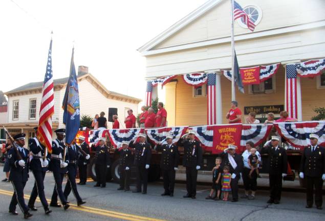 Warwick welcomes firefighters from near and far The Stewart Air Force Base Color Guard passes the reviewing stand.