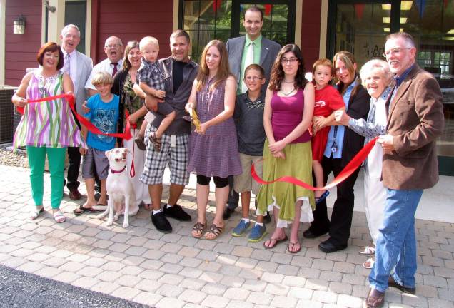 Wine and Design celebrates grand opening Photo by Roger Gavan Jennifer Marsh (center), surrounded by her family, staff and members of the Warwick Valley Chamber of Commerce, cuts the ribbon held by New York State Assemblywoman Annie Rabbitt and Town of Warwick Supervisor Michael Sweeton to officially open Wine & Design in the Meadowcrest Plaza at 133 Route 94 South.