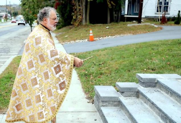Father George Kevorkian blesses the new stairway which leads from street level up to St. Ignatius Orthodox Church in the Village of Florida.