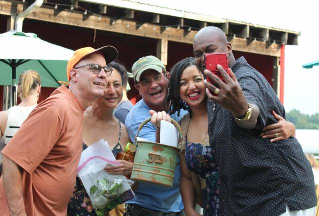Backyard gardeners open their gates for Kitchen Garden Tour In a garden party selfie, Patrick Moynihan (center) shows off his award for Most Hospitable garden.