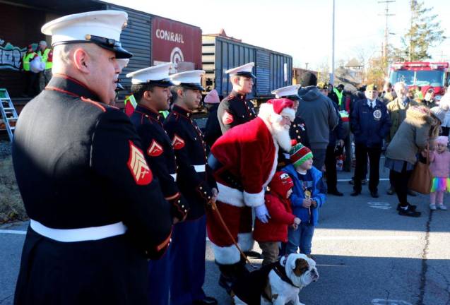 Santa was on board with the elves and Marine Corps detachment, MAG -49, and their mascot “Pvt. Caffe.” They spent almost an hour posing for photographs with children and families.
