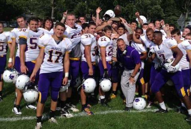 Wildcats roll behind offensive line The seniors on the Warwick Valley High School Varsity Football Team celebrate last SaturdayþÄôs 41-7 victory against Goshen in the resumption of the annual contest between the two schools for the Spirit Trophy.
