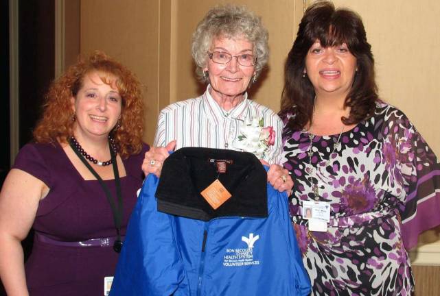 Volunteers gave 97,652 hours to three hospitals in 2011 Catalina Rosa of Warwick, center, who volunteered 1,124 hours last year at St. Anthony Community Hospital in Warwick, is congratulated by Andrea Studnitzer, and Amy Moore, volunteer coordinators for Bon Secours Charity Health System, at an April 20 volunteer recognition brunch at the Sheraton Crossroads, Mahwah, N.J.