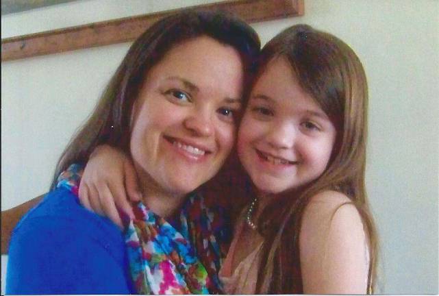 Mother Daughter Look A Like contest Photo submitted by Kathy Lennon of Warwick Kathy's daughter Kerry Lennon-Murphy and granddaughter Josie Murphy. "Enjoying each other at Grandma and Grandpa's house."