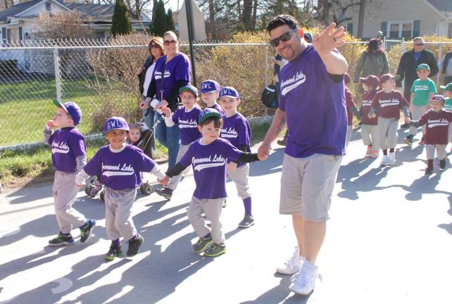 Play ball A T-Ball team marches down Windermere Avenue during the opening day parade last Sunday in Greenwood Lake.