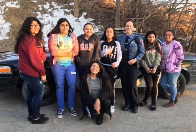 Warwick Police officer talks to local girls about a career in law enforcement Provided photo Warwick Police Officer Katie Hansen with members of the Young Outstanding Latina Organization.