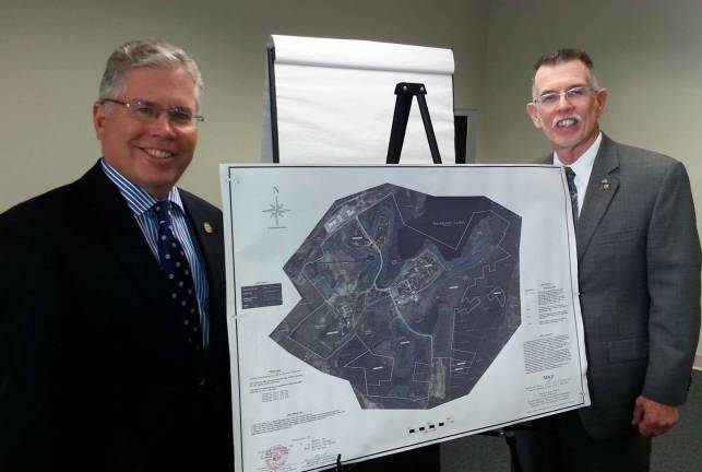 Sweeton addresses prospects for former prison property Town of Warwick Supervisor Michael Sweeton, right, and Richard Hagerty, CEO of Hudson-Gateway Association of Realtors, stand astride a map of the 726-acre former Mid-Orange Correctional Facility.