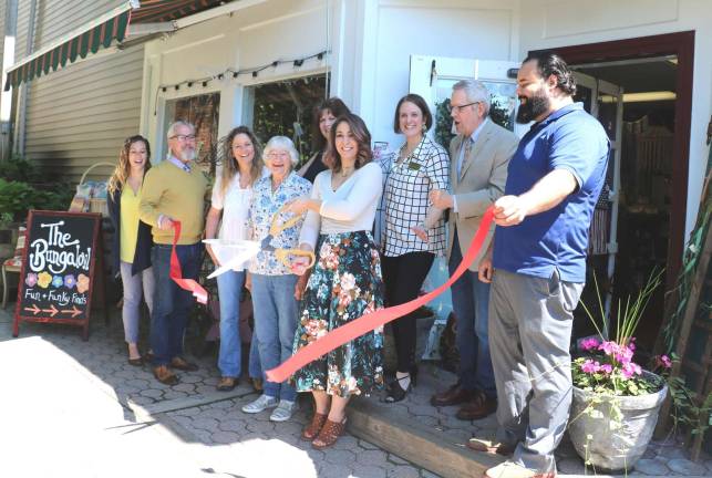 The Bungalow celebrates first anniversary Photo by Roger Gavan On Thursday, May 24, Warwick Mayor Michael Newhard (far left) and members of the Warwick Valley Chamber of Commerce joined owner Amy Fritzky (center), her mother and grandmother, to celebrate the store's first anniversary with a ribbon cutting ceremony.