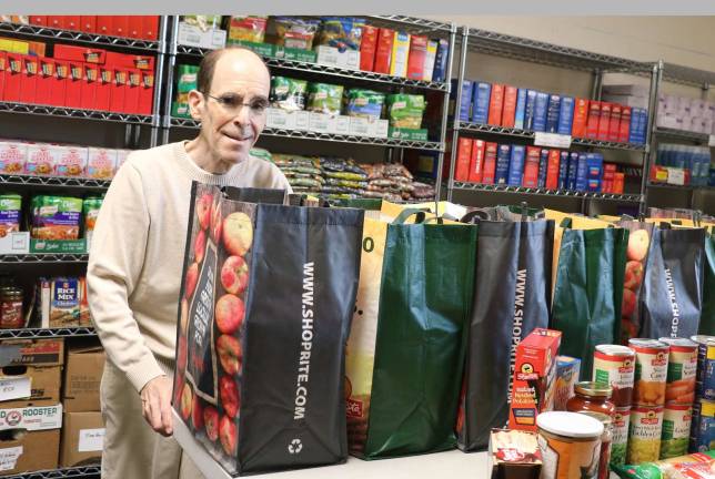 Warwick Ecumenical Food Pantry Thanksgiving and Christmas holiday program Photo by Roger Gavan Warwick Ecumenical Food Pantry Director Glenn P. Dickes is encouraged by the holiday program response to date.