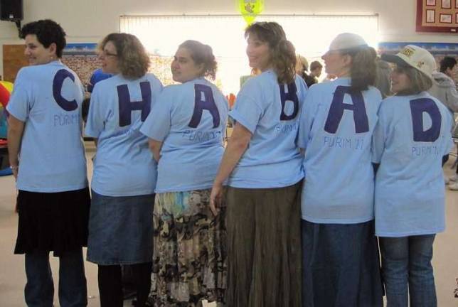 Dress up, step out for Purim Last year, women dressed as cheerleaders chanted the Chabad rhythm (from left): Jocelyn Figueroa, Lisa Nathan, Amy Racanelli, Beth Mindes, Marissa Grant-Morse, and Lauren Weinstein.