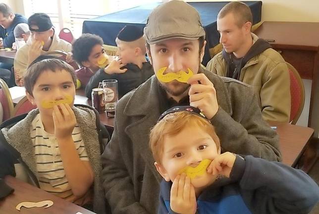 Hanok and Noe Larson of Monroe and their dad Adam at A&amp;Wesome Aba Father’s Day event at Chabad Hebrew School.