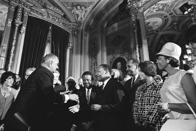 'To carve a tunnel of hope through the mountain of despair' Source: Library of Congress President Lyndon B. Johnson accepts the hand of Dr. Martin Luther King Jr. following the president's signing of the Voting Rights Act of 1965.