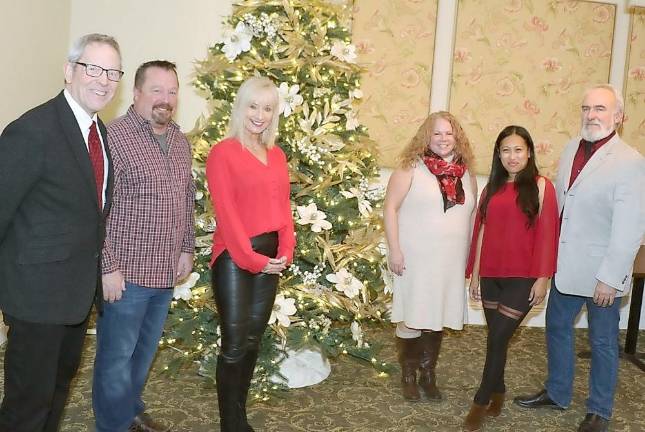 Gathered Around the Christmas Tree at the Warwick Valley Country Club to plan the upcoming Tuesday, Dec. 3, Holiday Mixer for the Warwick Valley Chamber of Commerce are, from left, Executive Director Michael Johndrow, Warwick Valley Country Club President Chris Zimmerli, Warwick Chamber Programs Chair Janine Dethmers, chamber office assistant Lori Cosgrove, Chamber Programs Committee Member Ia Faroni and Chamber President John Redman.