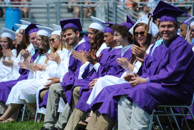 The Warwick Valley Class of 2013 Photo by Louise Hutchison Graduates applauding their classmates.
