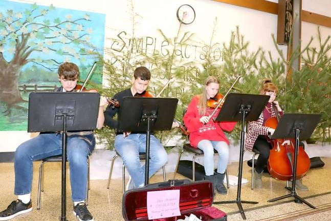 Members of the Warwick Valley High School Orchestra were on hand to provide traditional holiday music.