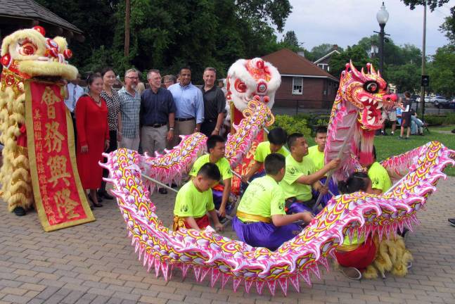Cross cultural anniversary Photo by Roger Gavan Traditional Chinese Lion and Dragon dancers pose with dignitaries.