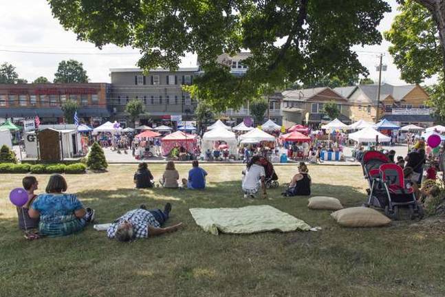 Celebrating community in Florida, NY People relax on the front lawn of the First Presbyterian Church of Florida during the annual Florida Funfest along Main Street on Sunday afternoon Aug. 10.