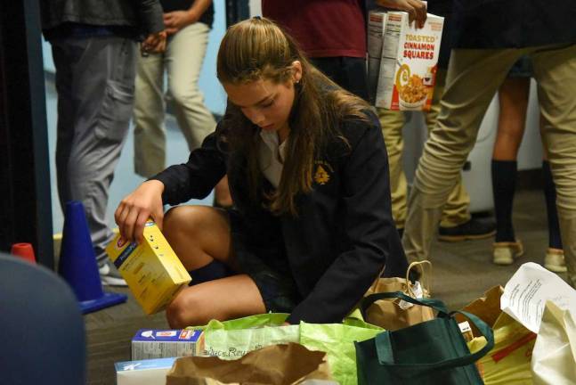 Tuxedo Park School jump-starts weekend backpack meal program Photo by Christopher Kasker, Tuxedo Park School Tuxedo Park School eighth-grader Ally Turner of Warwick sorts through food items at George Grant Mason School in Tuxedo. Tuxedo Park School families donated the items as a community service project to support the Tuxedo School District’s BackPack program.