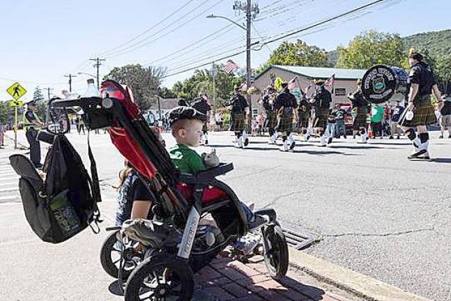 You can’t be too young to enjoy a parade - or too young to honor your roots.