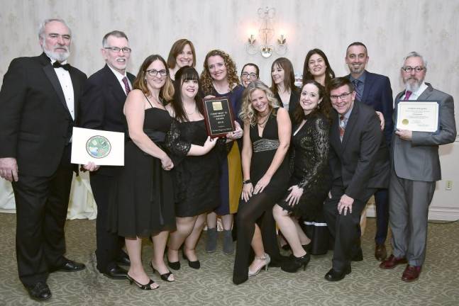 The Warwick Playground Dreams Committee received the Commitment to Community Award at the Chamber of Commerce festivities. Chamber Board President John Redman, far left, joined by Warwick Supervisor Michael Sweeton, second from left, and Warwick Mayor Newhard, far right, presented the award.