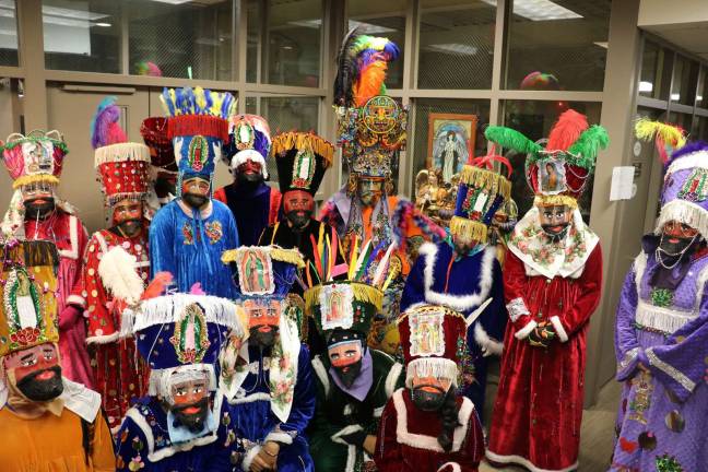 Bi-lingual Mass at St. Stephen's honors Our lady of Guadalupe The "Comparza de Chinelos." Dancers.