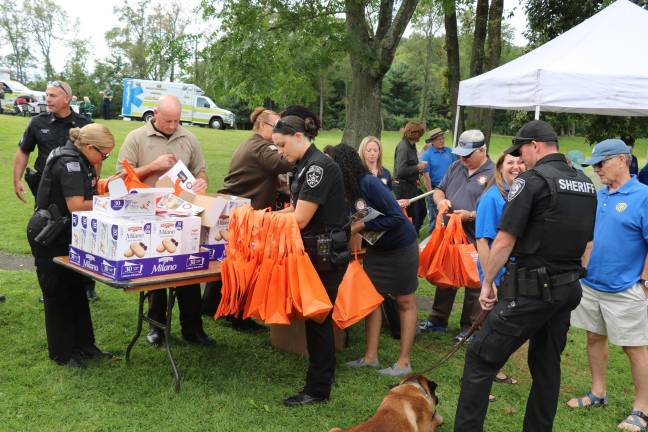 Members of the Orange County Sheriff's Department prepare to help serve special treats.