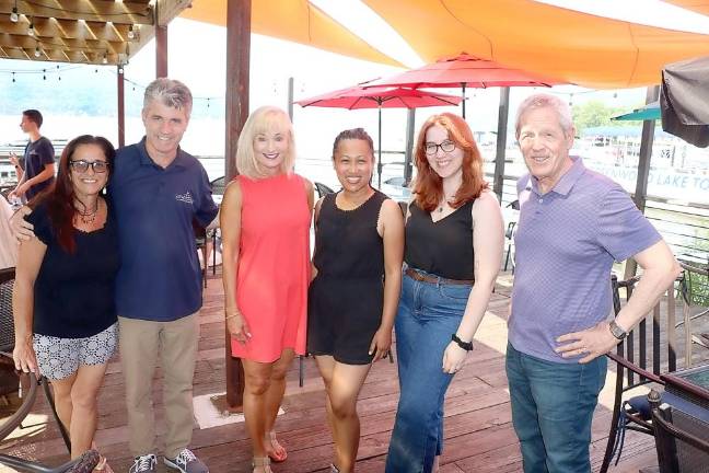 Gearing up for The Warwick Valley Chamber of Commerce July 29 lakefront business mixer are, from left: Cove Castle Manager Andrea Muster, Proprietor Bob Pereira, Warwick Chamber Programs Members Janine Dethmers and Ia Faroni, Chamber Public Relations Coordinator Olivia DiCostanzo and Chamber Executive Director Michael Johndrow. Photo by Roger Gavan.