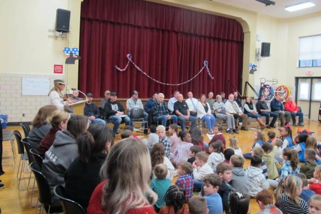 Greenwood Lake Elementary School Principal Dianne Connolly greets the veterans.