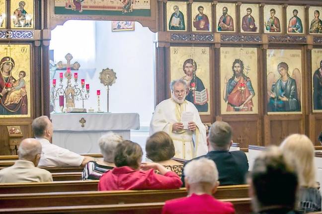 Provided photo The Rev. George Kevorkian, pastor of St. Ignatius Antiochian Orthodox Church, with parishioners before new rules call for live streaming video.