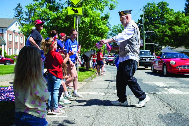 Departed veterans honored Veteran handing out flags