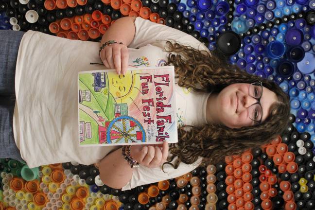 Pippa Carey wins art contest Pippa Carey with her winning cover