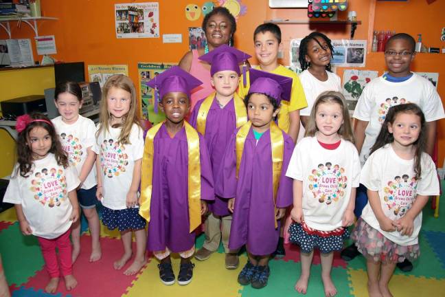 Love Grows Child Care graduation Photo by Christine Merson Front from left: Emelia Trombino, Sophia Amato, Cailynn Boyle, graduates Parker Walters, Peter Fernandez and Julian Cartagena, Addison Emm and Kendall Weiss. Rear from left, Bryce Walker, Dariel Patterson and Theodore Fernandez with owner and director Cecelia Cenot.