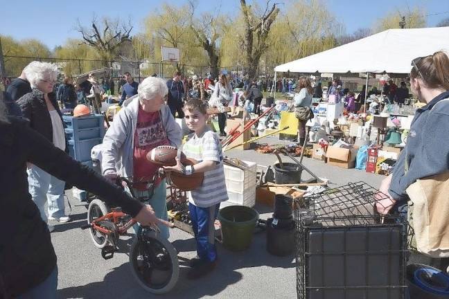 A youngster found a football in the hundreds of items that were donated and sorted into shoppable departments. Bicycles are popular,too.