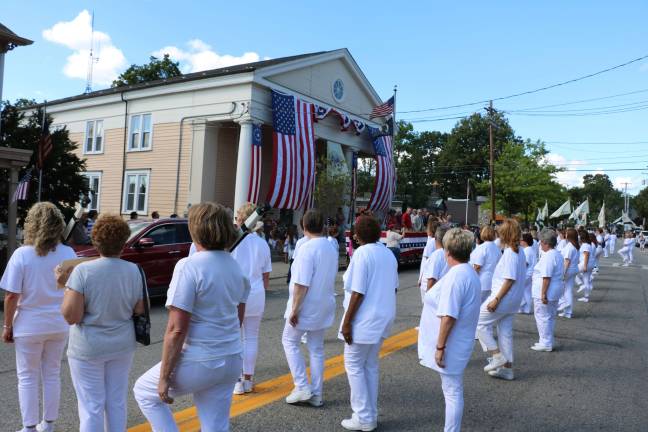 Village of Warwick celebrates 150 years Former members of the Queens Village Queens, which was formed in 1961 and remained active until 2001, participate in the parade.