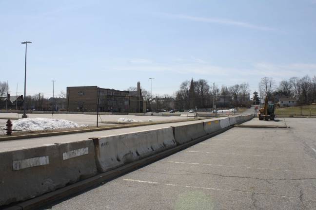 Work begins on government center Concrete barricades are lined up in the Orange County Government Center parking lot in Goshen as demolition prep work begins. Photo by Nathan Mayberg