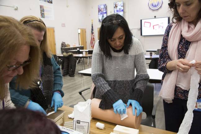 Warwick Valley teachers, staff get life-saving trauma training Provided photos Sanfordville Elementary School Nurse Creslyn Driscoll treats a simulated wound during Stop the Bleed, Save a Life training.