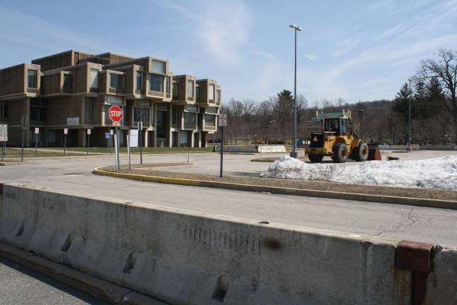 Work begins on government center Cement barricades separate the Orange Government Center parking lot from a traffic circle in front of the center on Monday in Goshen. Photo by Nathan Mayberg.