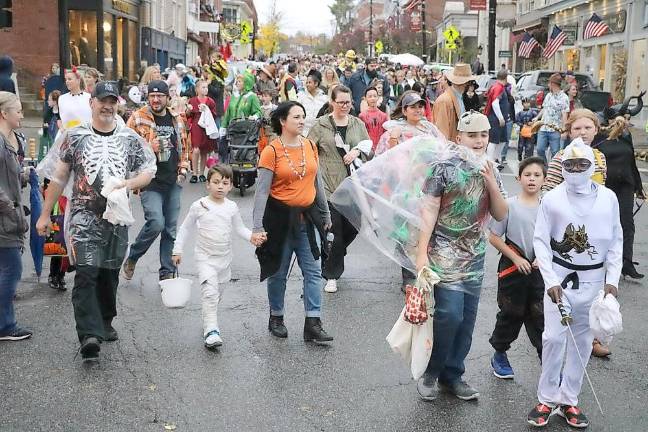 The year in review It took approximately 25 minutes for everyone in the Halloween parade, stretching almost the full length of Main Street, to reach that destination.
