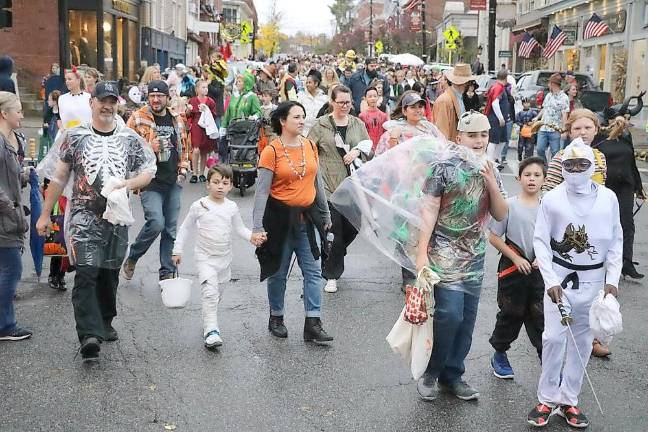 It took approximately 25 minutes for everyone in the Halloween parade, stretching almost the full length of Main Street, to reach that destination.