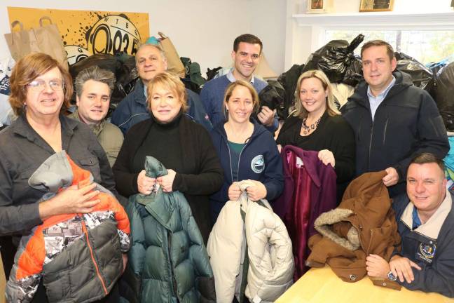 WTBQ's 'Share the Warmth' coat drive for needy families huge success Photo by Roger Gavan The WTBQ newsroom was filled with a record number of coats from the "Share the Warmth" annual coat drive. Pictured from left: WTBQ Station owner Frank Truatt, HONOR Executive Director Chris Molinelli, Station Manager Taylor Sterling, Town of Monroe Supervisor Tony Cordone (rear left), co-owner of Greenwood Lake Bagels Christine Moley, Mike Conway of CuraLeaf (rear right), Liz Schmidt of HONOR, Orange County Executive Steve Neuhaus and Assemblyman Karl Brabenec.