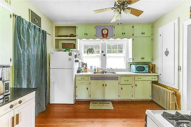 Charm and village convenience with quiet patio over fenced yard Charm and village convenience with quiet patio over fenced yard