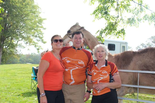 Register now for OC Bicycle Club’s annual ‘Ride with the Camels’ Photo provided 'Martin the Camel,' from The Sanctuary for Animals in Westown, along with Kristin Jensen, chief advancement officer of Catholic Charities Community Services of Orange and Sullivan, Monroe resident Bill Stelz, club president, and Goshen resident Peggy Cullen, club vice president, are preparing for the 2018 ‘Ride with the Camels’ charity bike event.