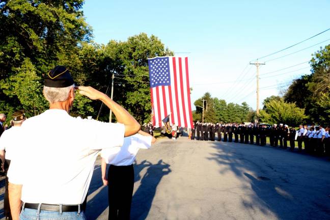 On September 11, local residents, public officials, veterans and members of the Warwick Police, Ambulance Corps and Fire Departments, and others gathered in Veterans Memorial Park to honor the victims of the 9-11 attack, especially those who lived in Warwick.