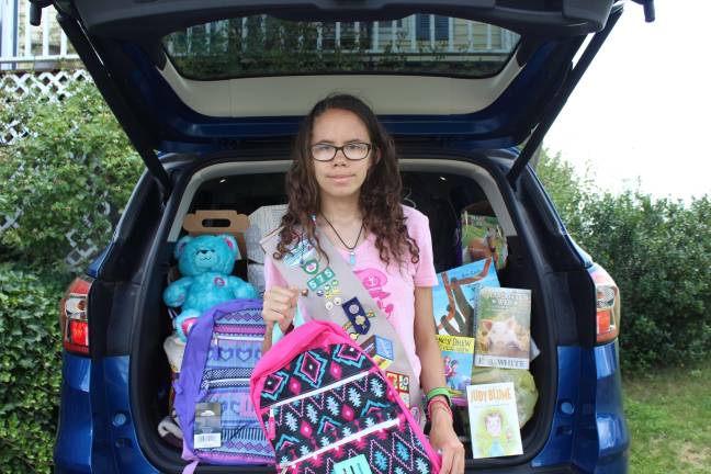 Girl Scout brings hope to children in foster care Warwick Girl Scout Amber Vitoulis with some of the donations collected to date. (Photo provided)