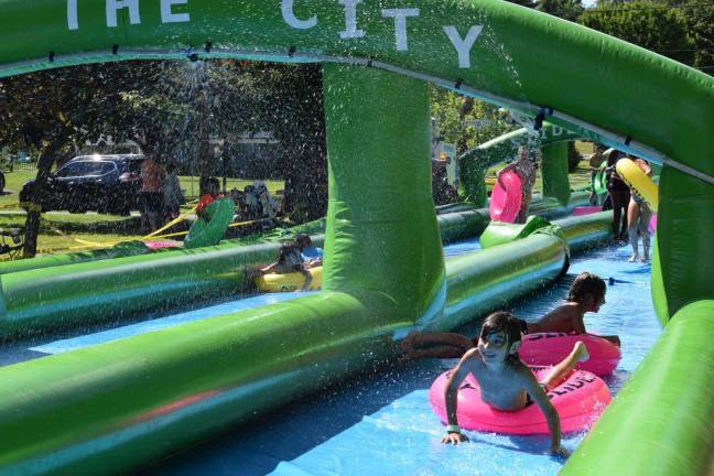 Water slide again to cool off Goshen File photo by Erika Norton Kids and adults alike enjoyed a 1,000-foot water slide in Goshen on a hot summer day last summer. The slide returns to Goshen on Aug. 4.